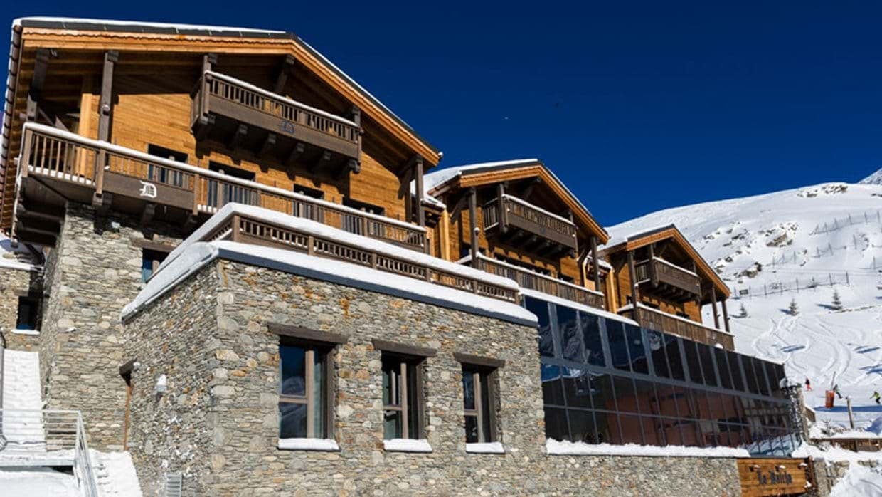Ski-in/ski-out chalet exterior with private balconies and mountain views