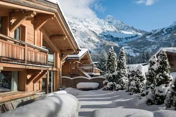Chalet exterior with private terrace and panoramic Alpine views