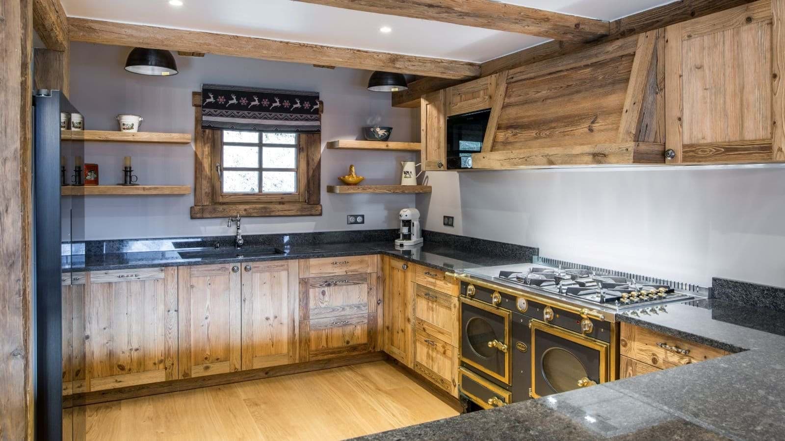 Chef's kitchen with La Cornue range and reclaimed wood cabinetry