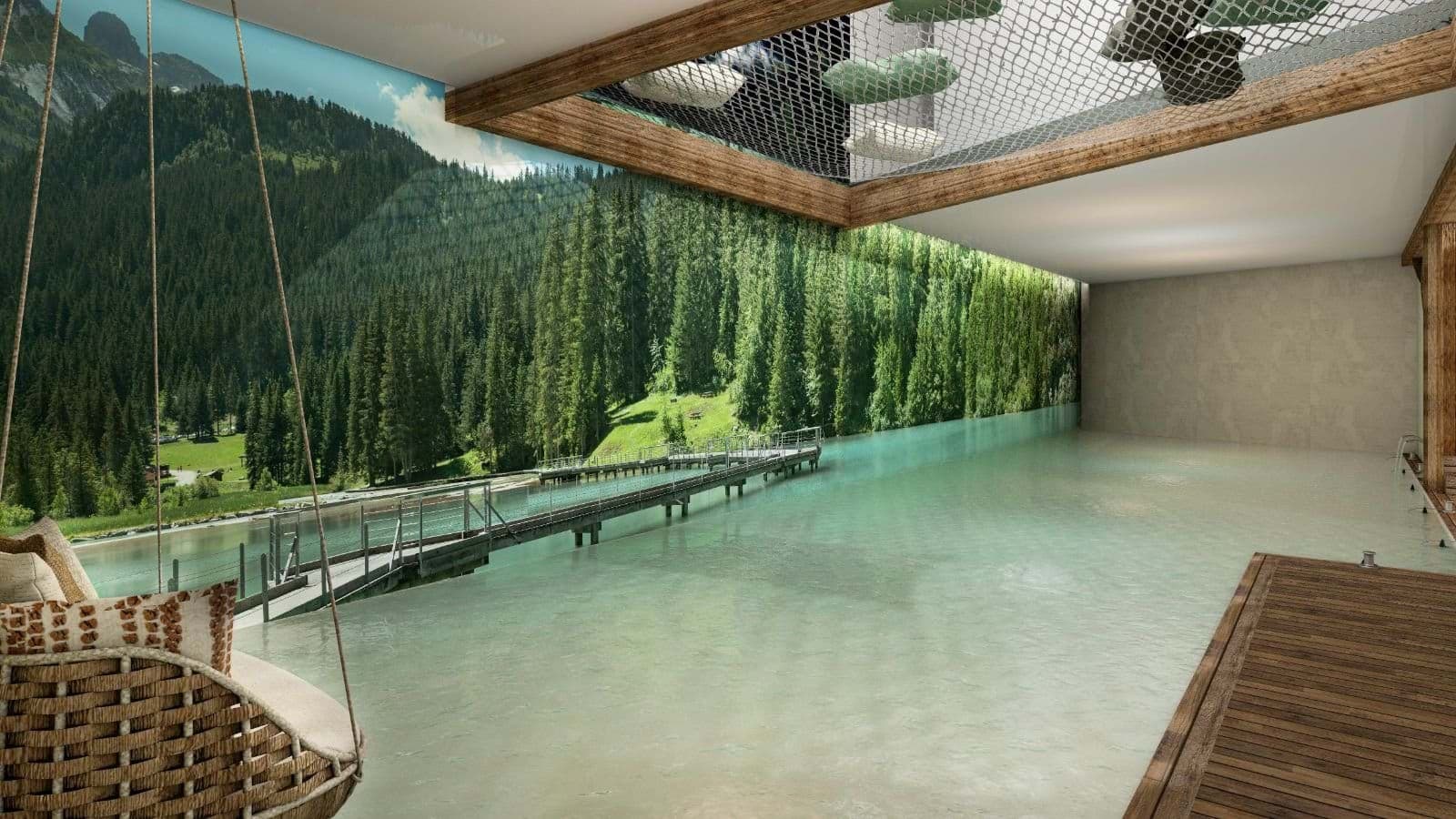 Indoor heated pool with mountain wall mural and ceiling hammock net