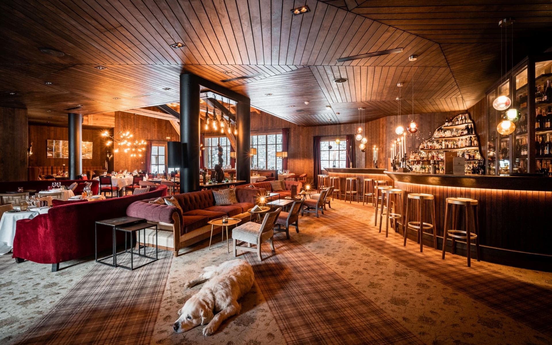 Lounge and bar area with velvet seating and full cocktail service