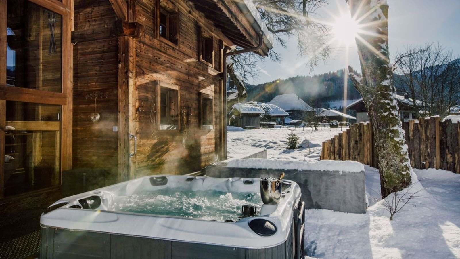 Outdoor hot tub seats 6; mountain views and timber chalet backdrop
