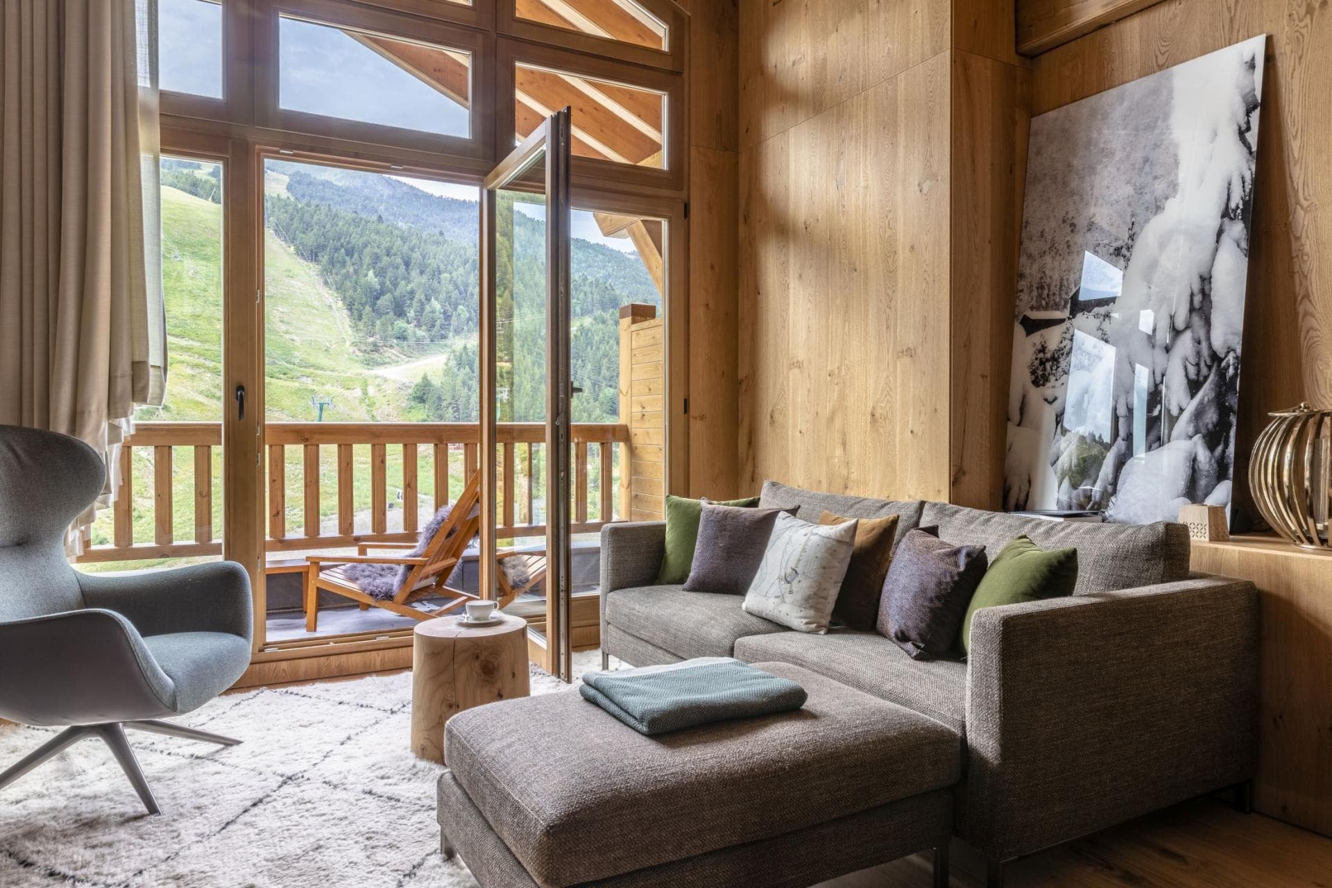 Living area with floor-to-ceiling windows and private balcony access