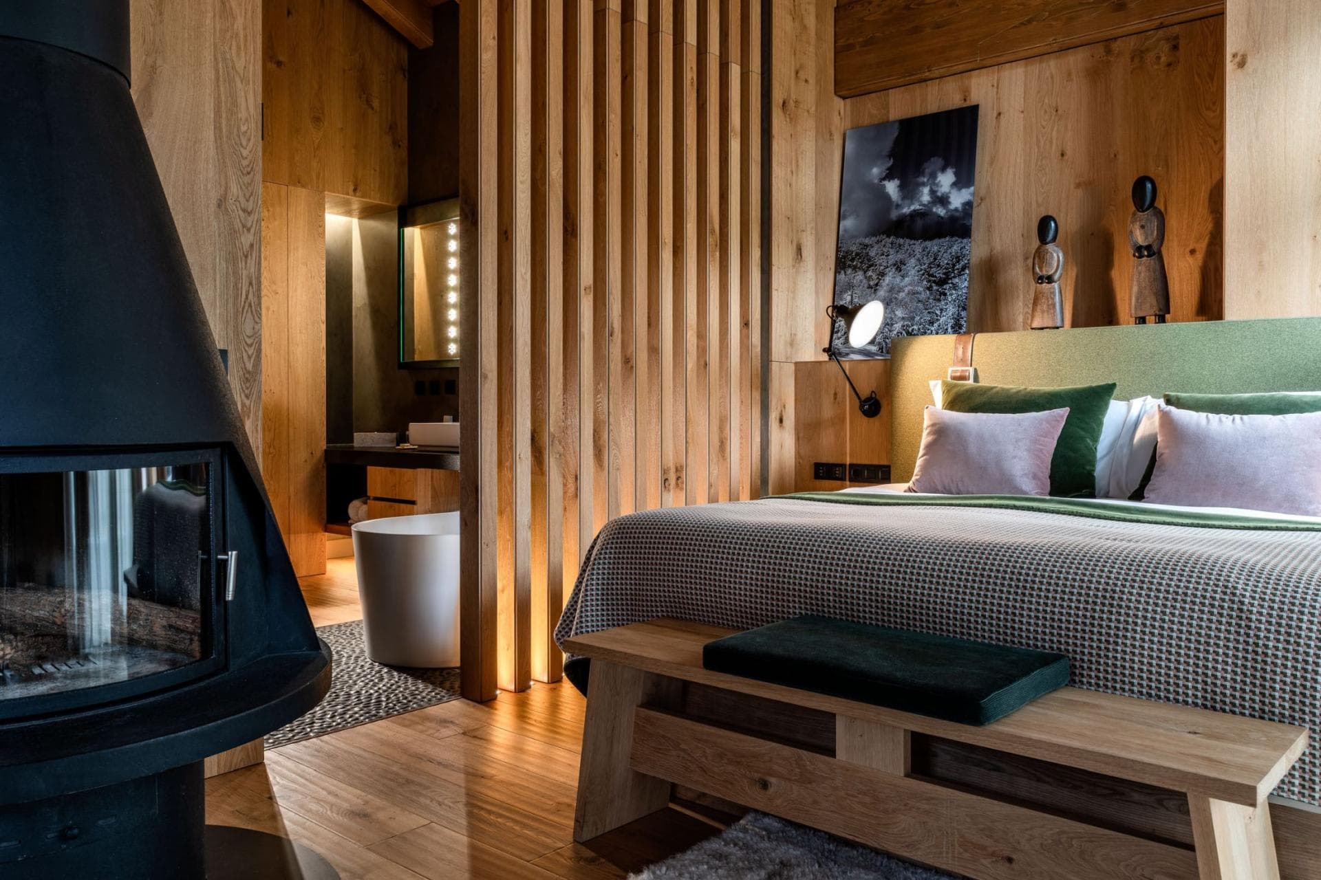 Primary bedroom with wood-burning fireplace and ensuite soaking tub