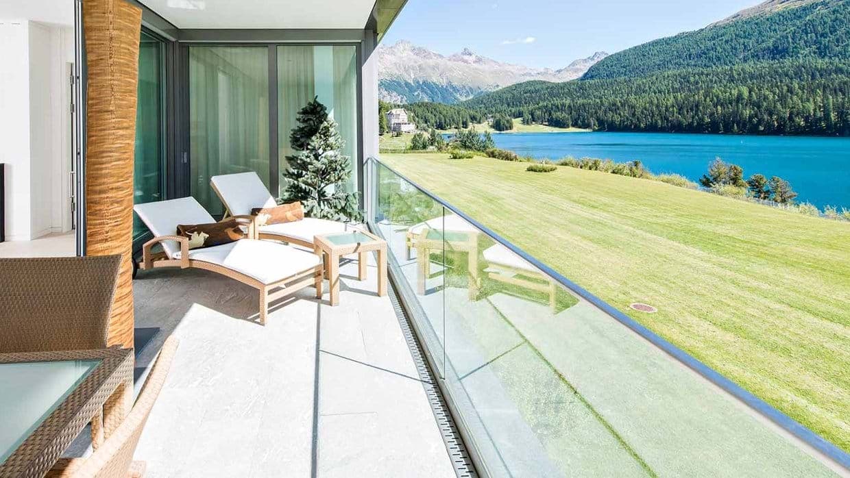 Private balcony with lounge seating and panoramic lake views