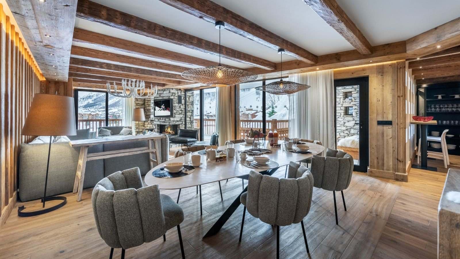 Dining area seats 8 with mountain views and wood-beam ceilings