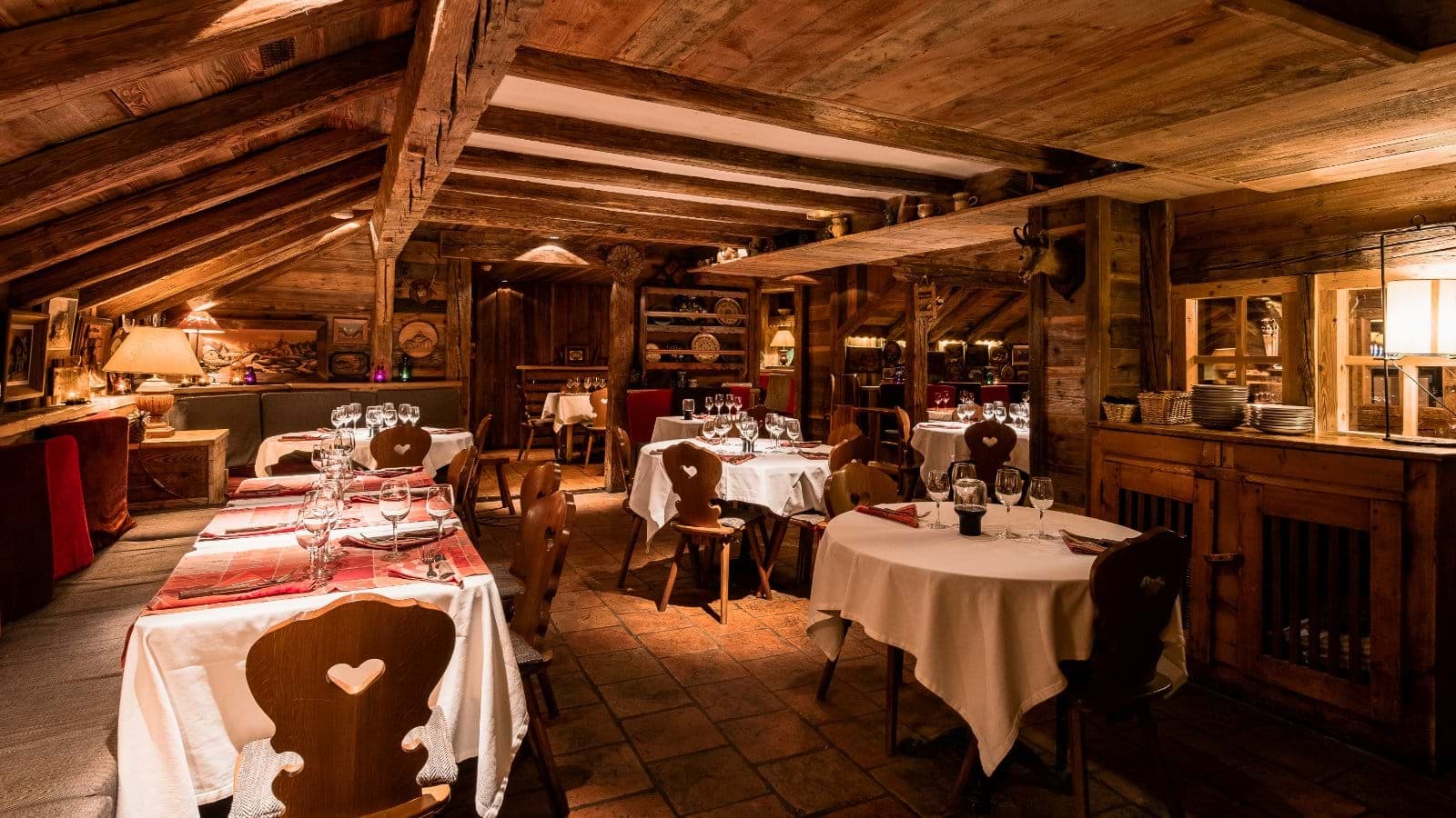 Dining room with reclaimed timber beams and banquet seating for large groups
