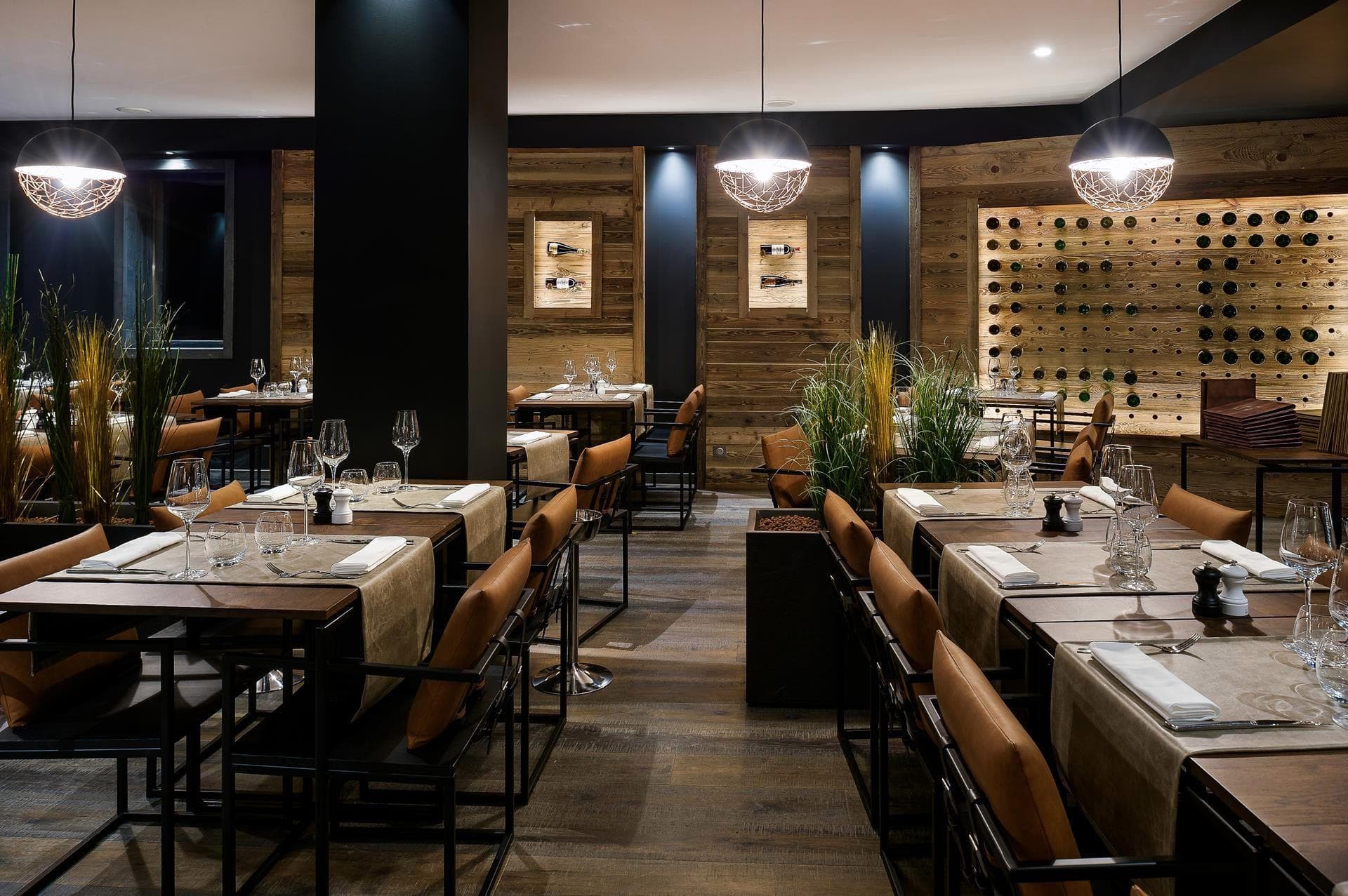 Dining room with wood-paneled walls and integrated temperature-controlled wine display