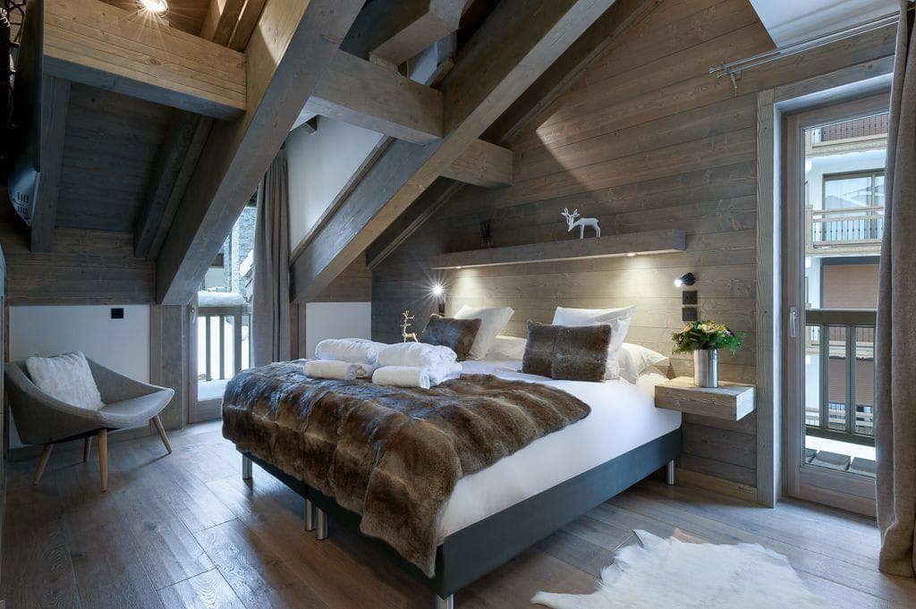 Loft bedroom with king bed and private balcony access