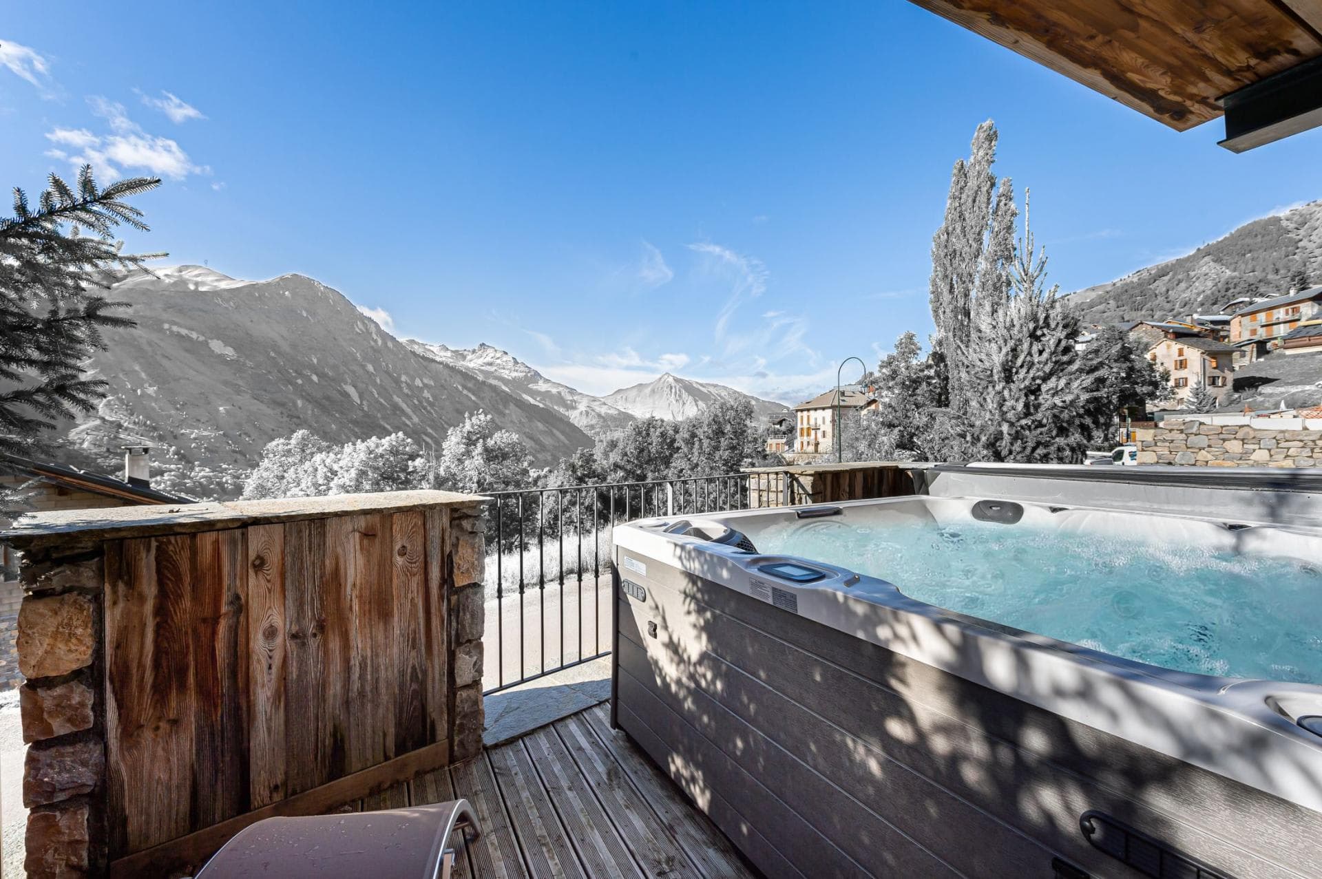 Outdoor hot tub on private deck with Tarentaise Valley views