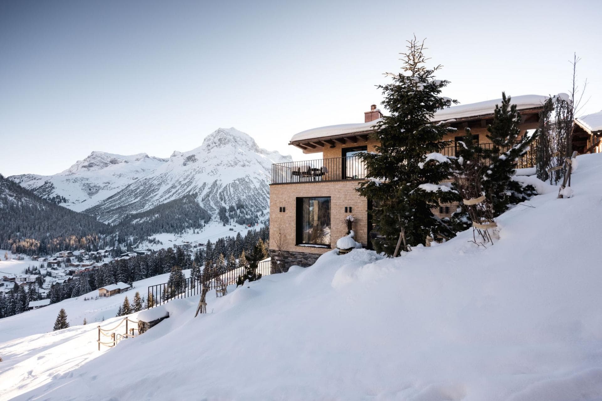 Chalet exterior with private balcony and panoramic mountain views