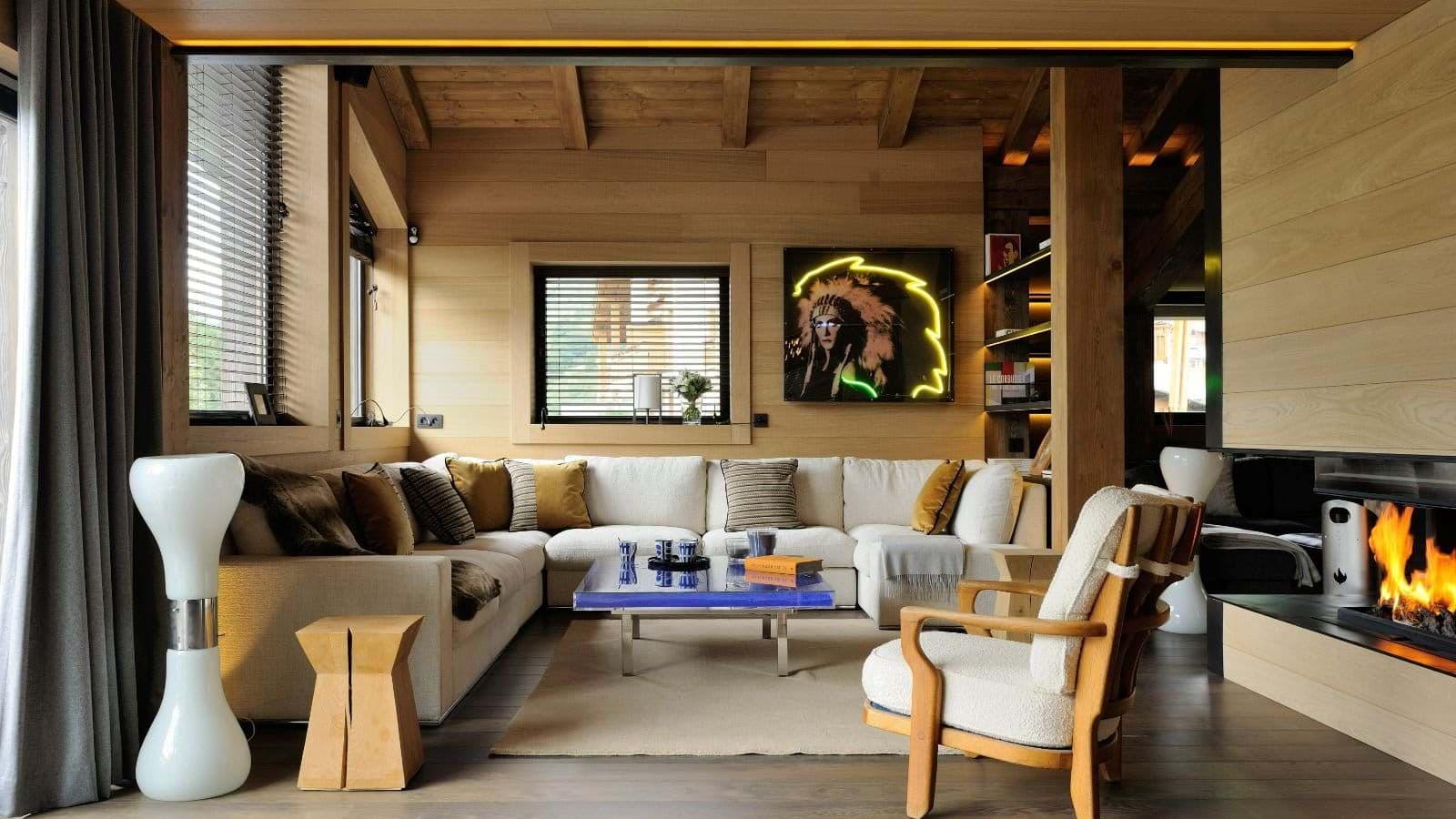 Living area with wood-burning fireplace and sectional seating for 8