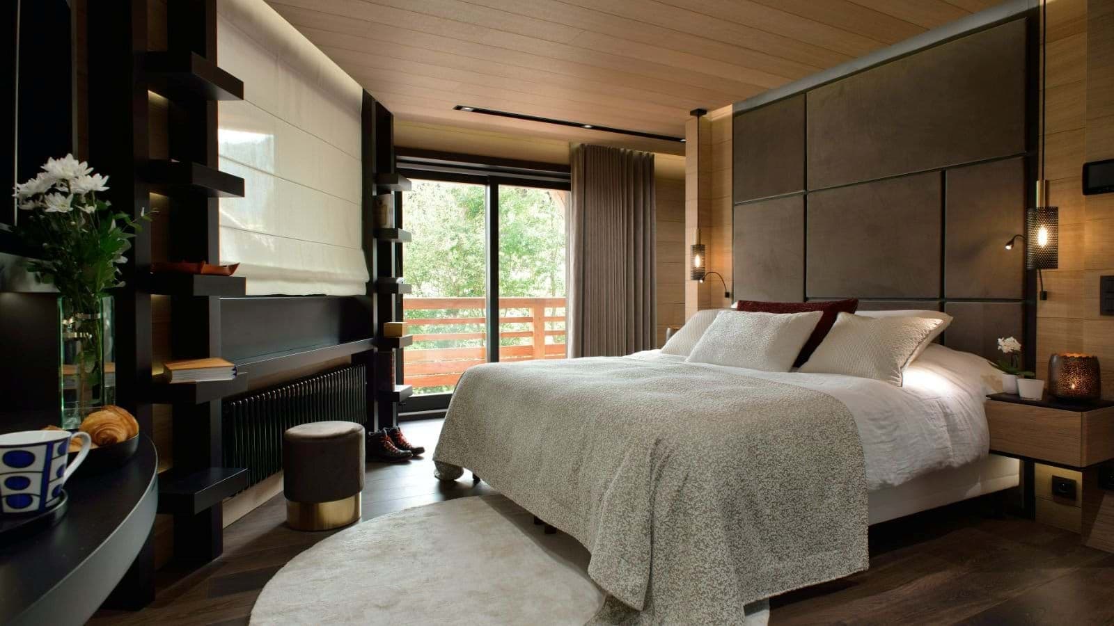 Primary bedroom with king bed and private balcony access