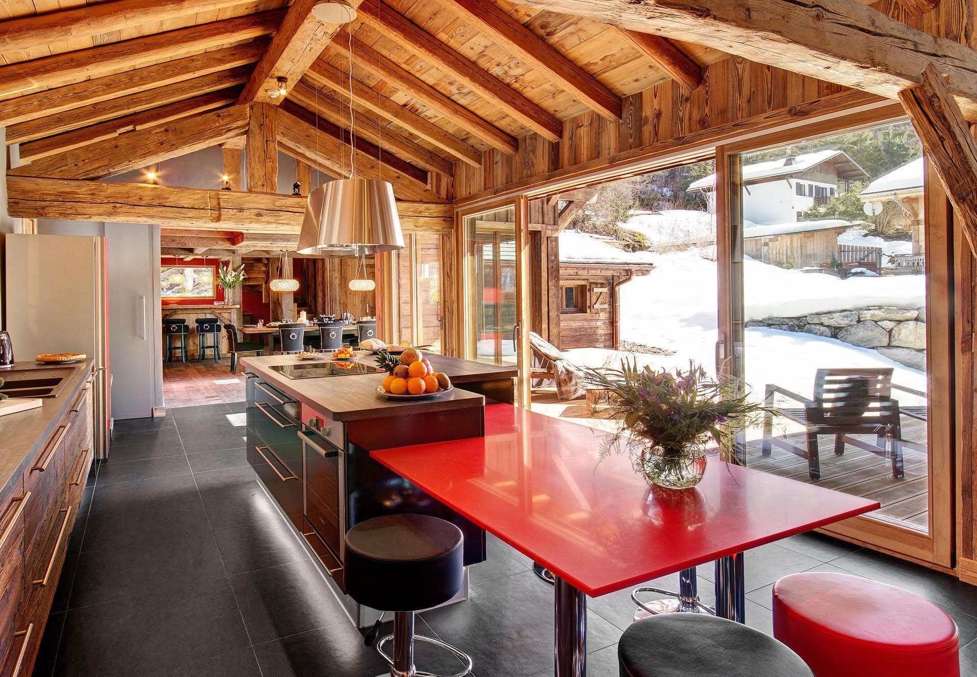 Kitchen with island induction cooktop and sliding doors to sun deck