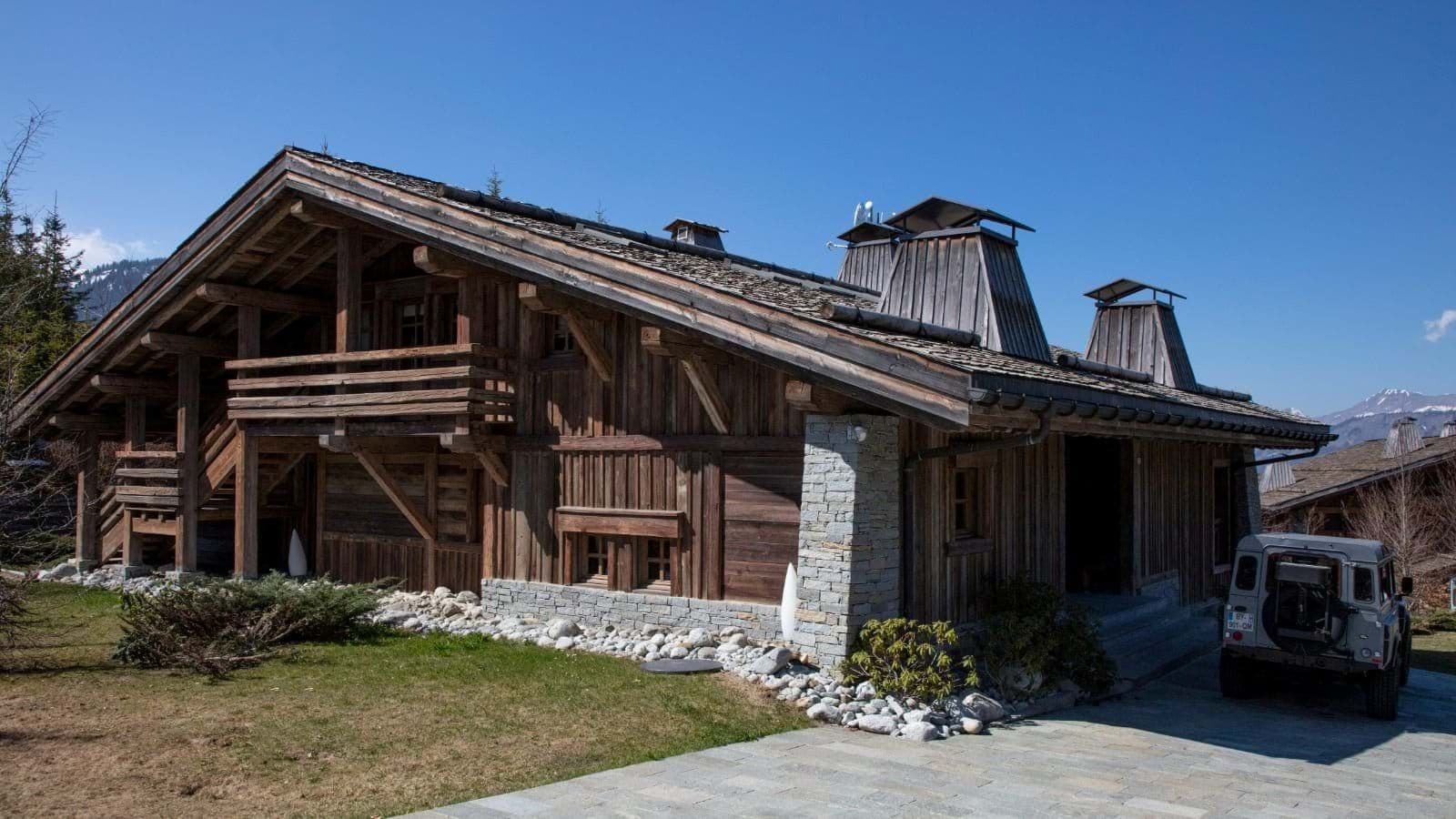 Timber mountain chalet with stone accents and private driveway parking