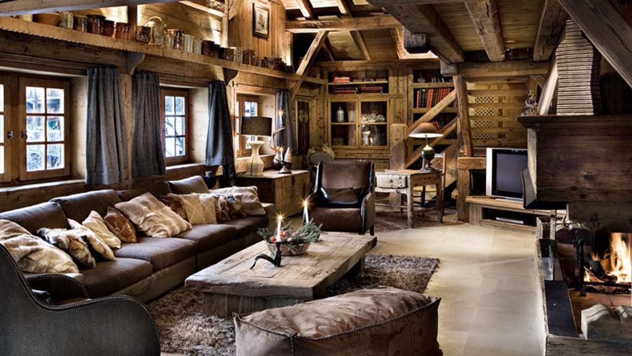 Living area with wood-burning fireplace, library nook, and seating for 8