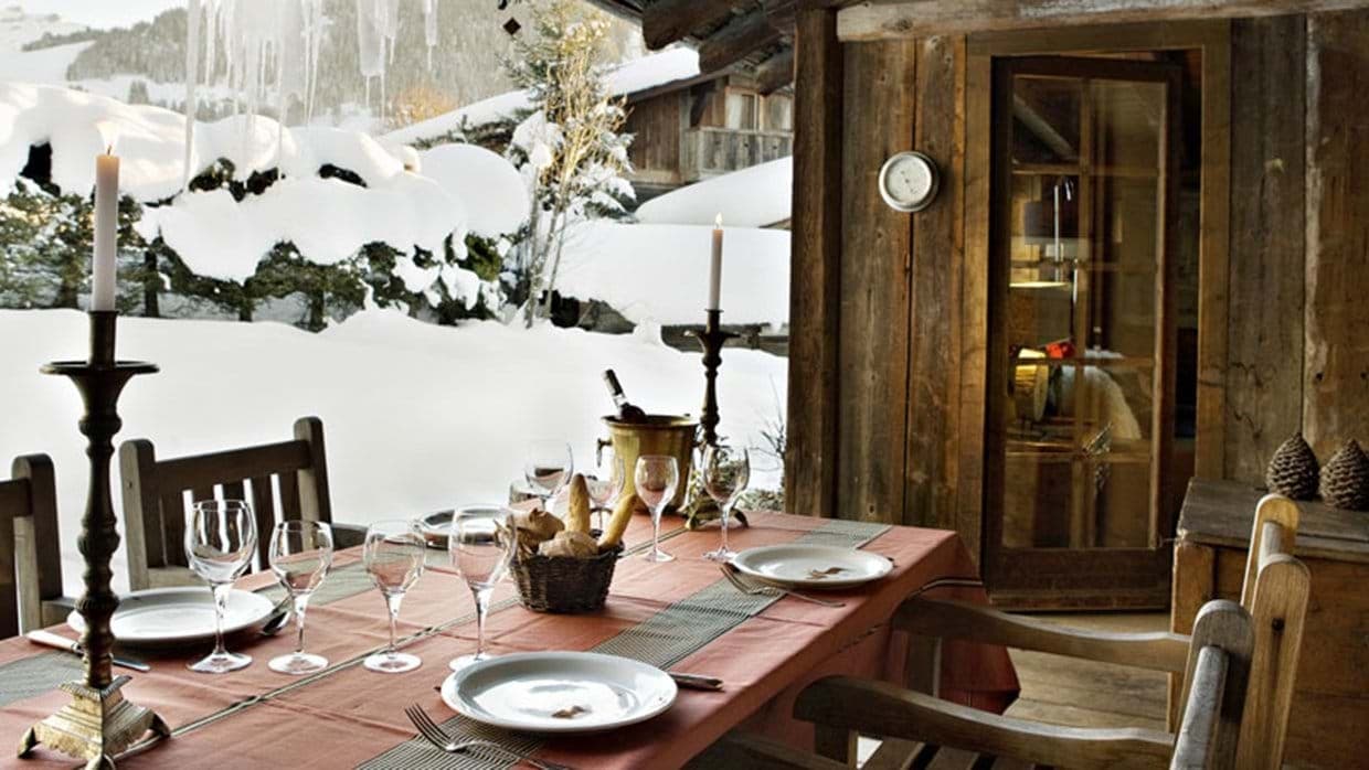 Covered outdoor dining area with seating for 6 and mountain views