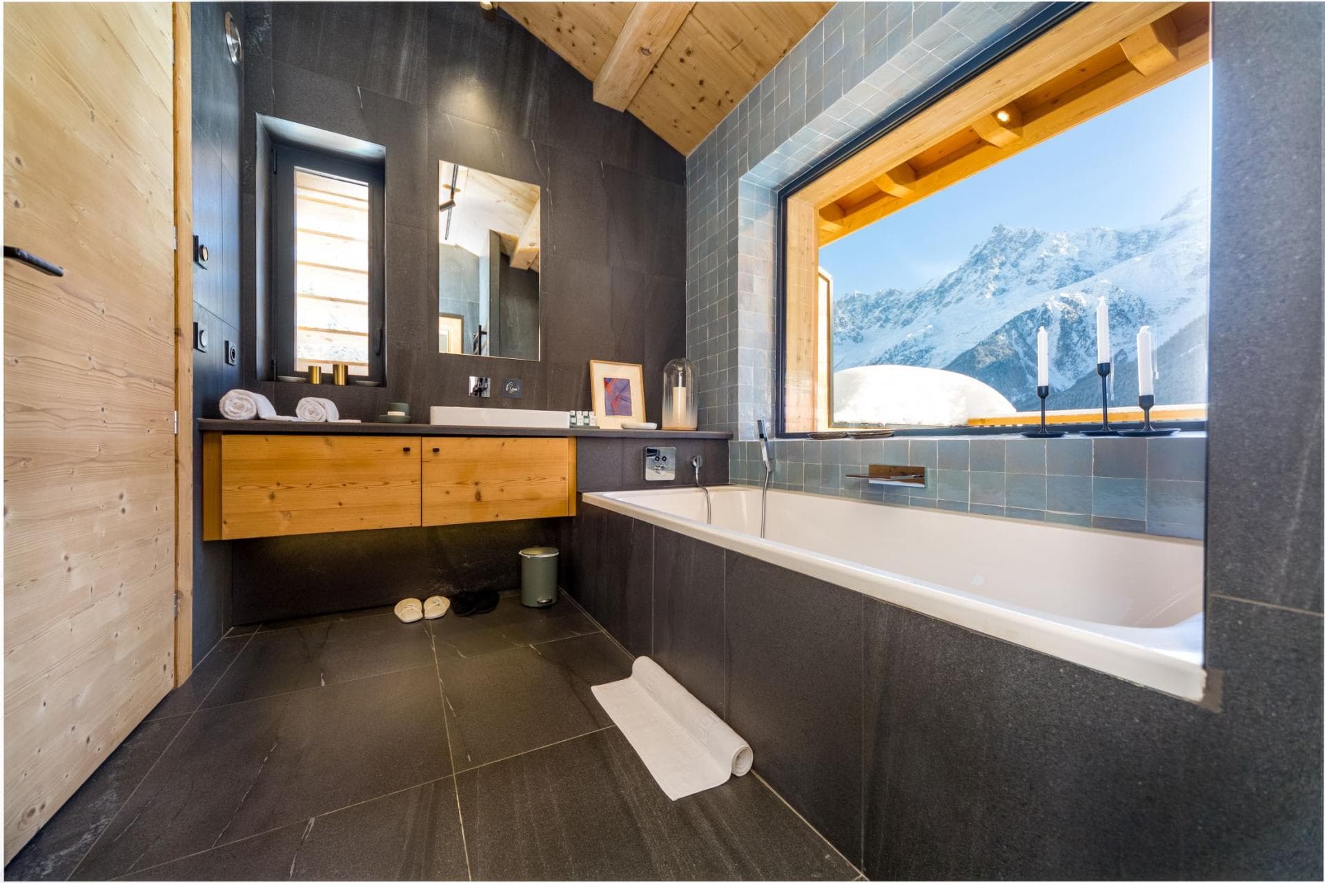 Bathroom with deep soaking tub and mountain peak views