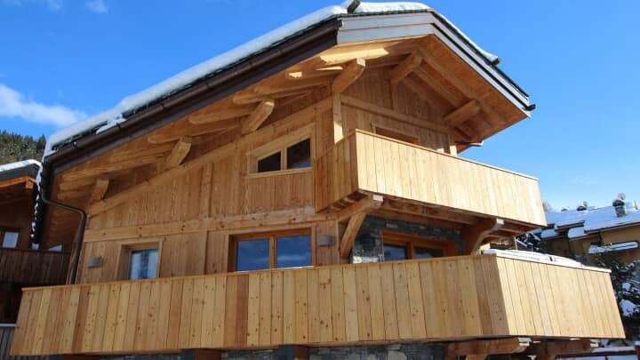 Chalet exterior with timber cladding and wrap-around balconies