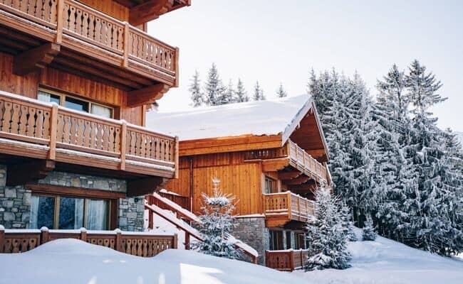 Ski-in ski-out timber chalets with private balconies and mountain views