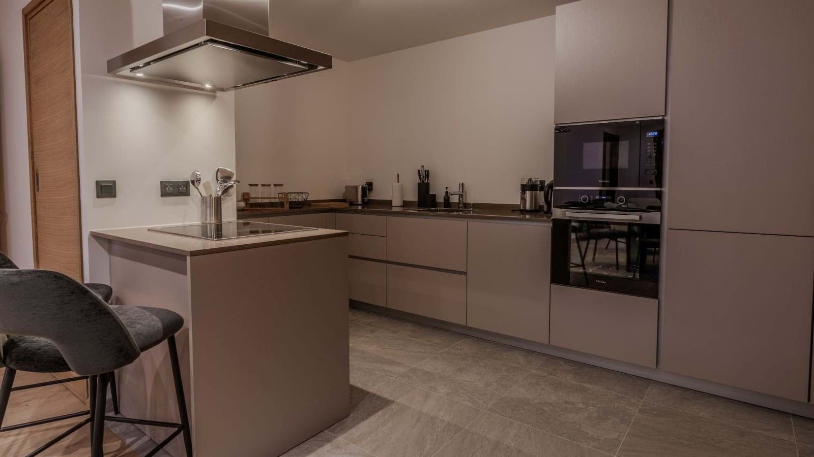 Kitchen with Miele appliances and island induction cooktop