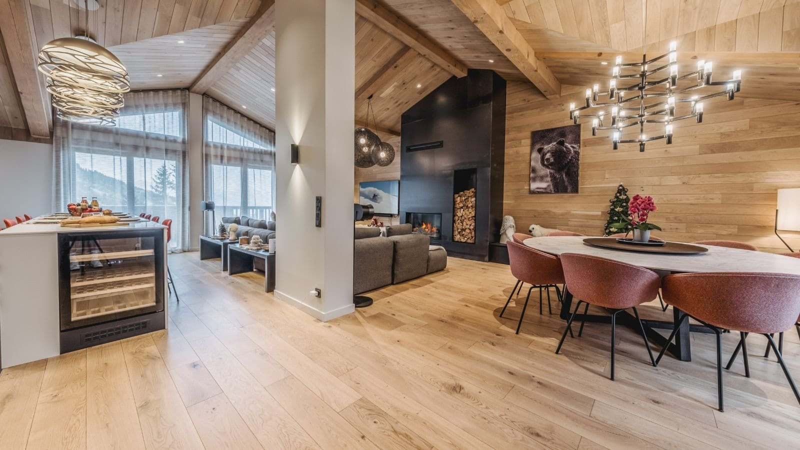 Open-plan dining area with 8-person table and built-in wine fridge