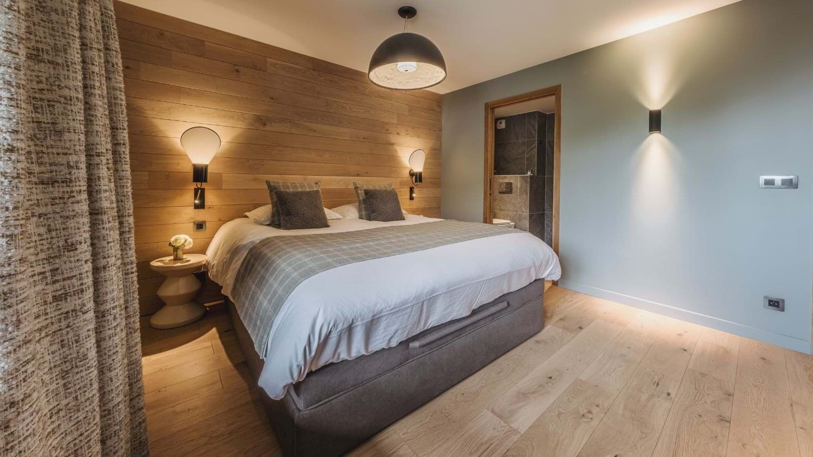 Primary bedroom with king bed and ensuite bathroom access