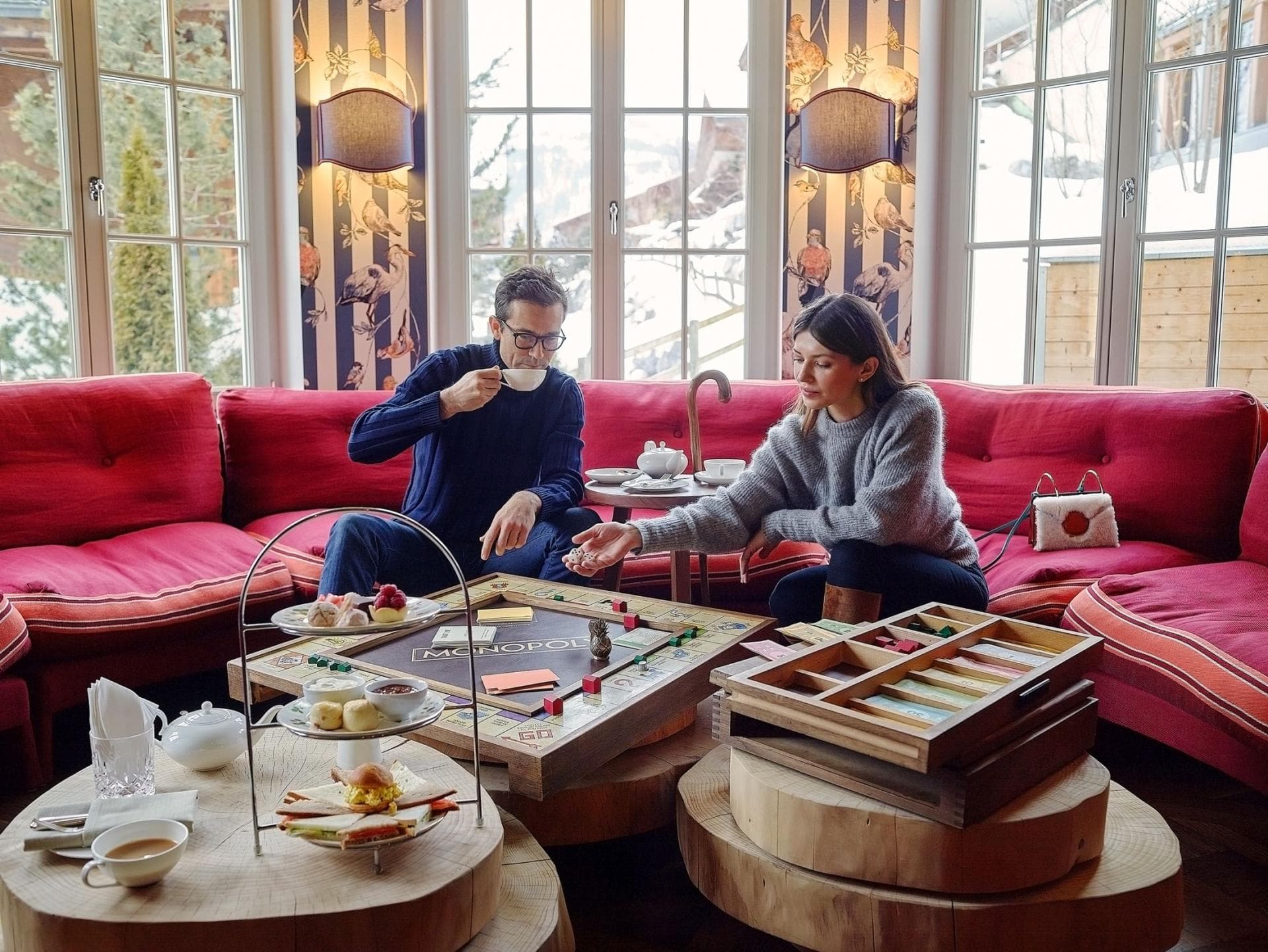 Lounge area with wrap-around seating and heirloom wooden board games