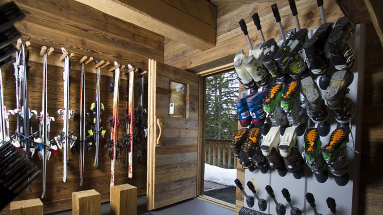 Ski locker room with heated boot rack and outdoor access