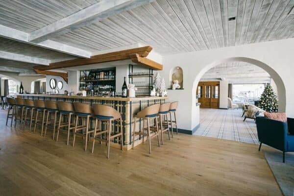 Lobby bar with seating for 12 and views of hotel entrance
