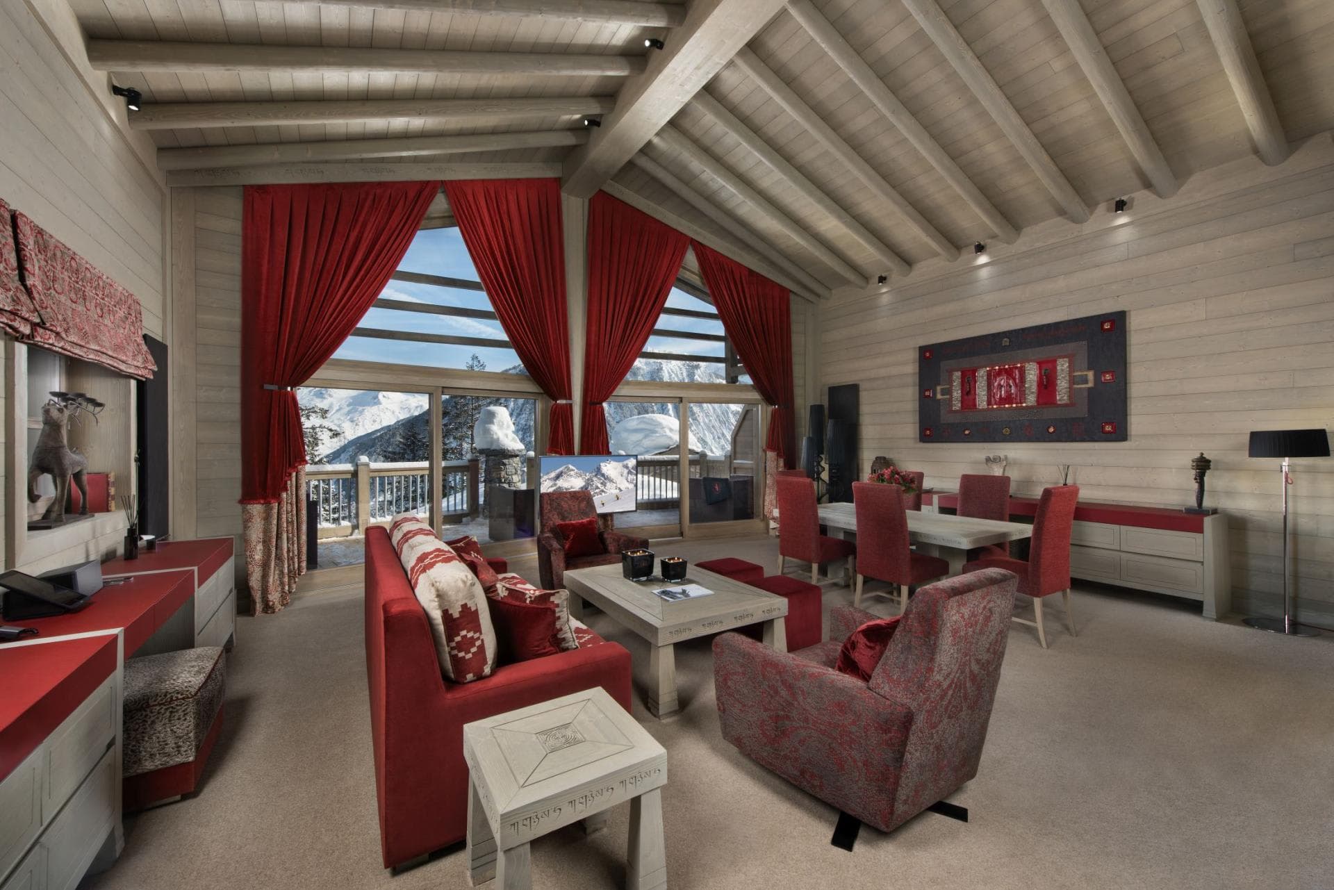 Open-plan living and dining area with mountain views and balcony access