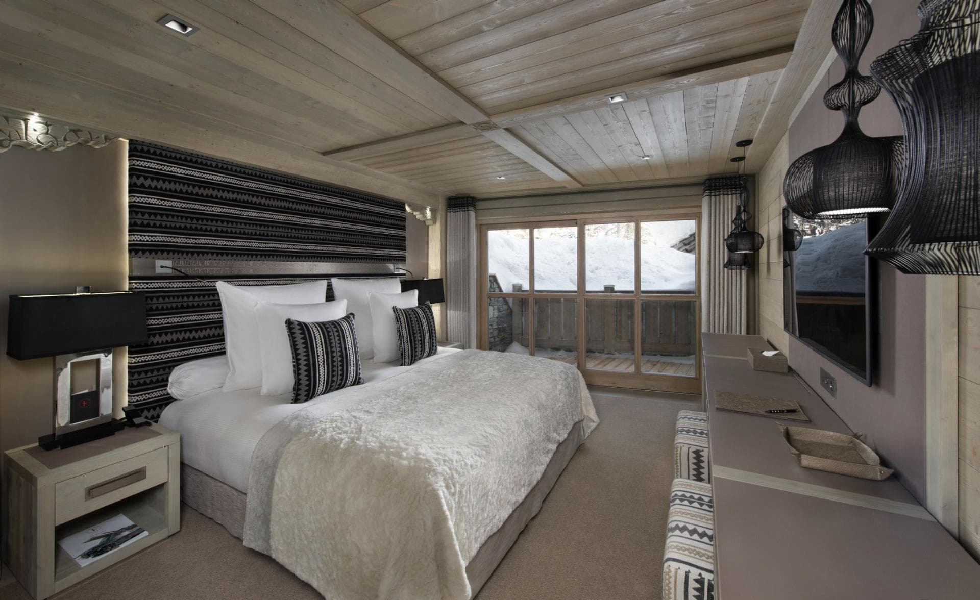 Primary bedroom with king bed and private balcony access