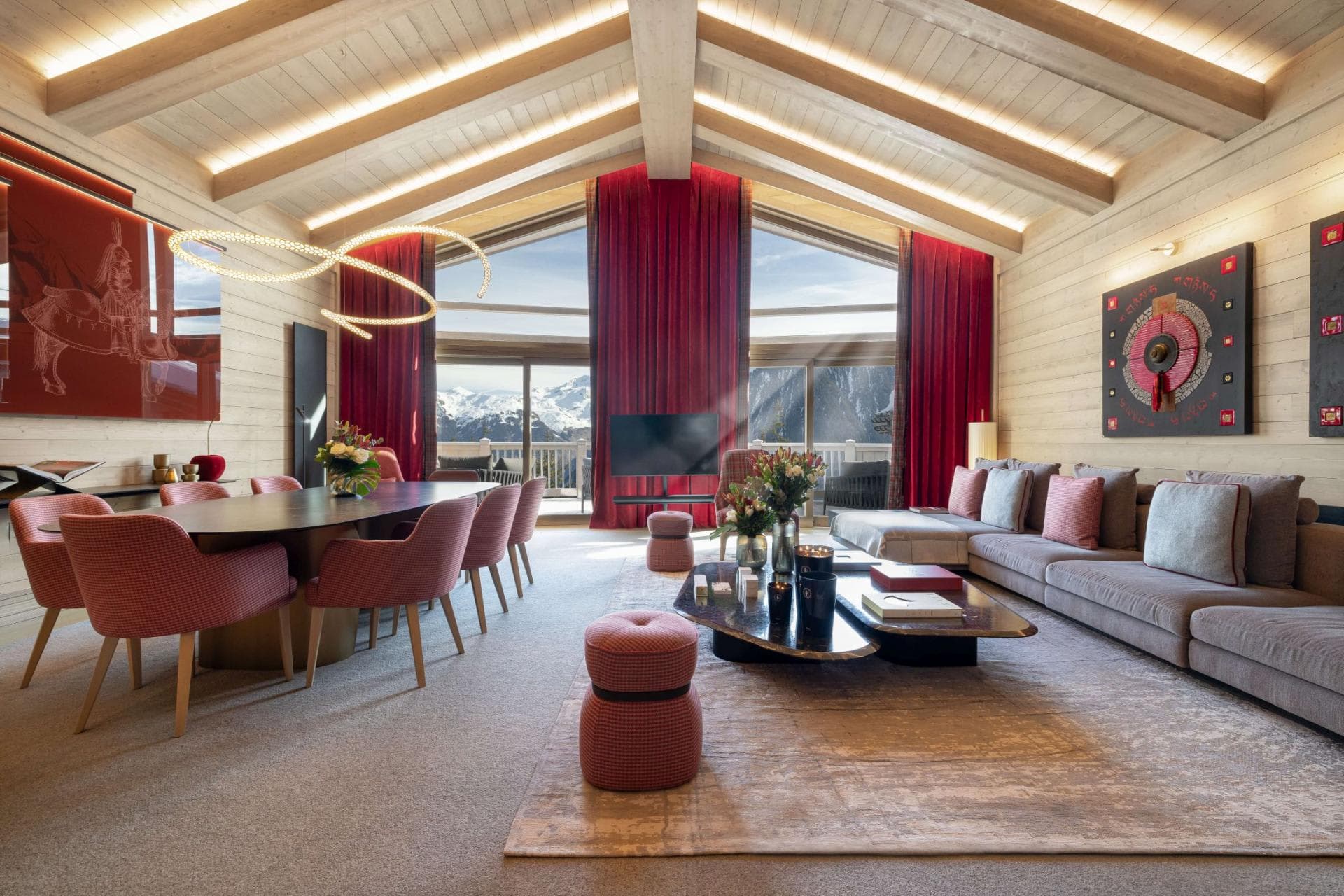 Open-plan living area with 10-person dining table and mountain views