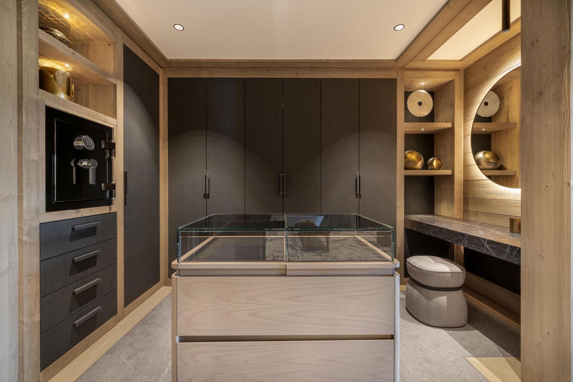 Walk-in closet with vanity station and built-in jewelry safe