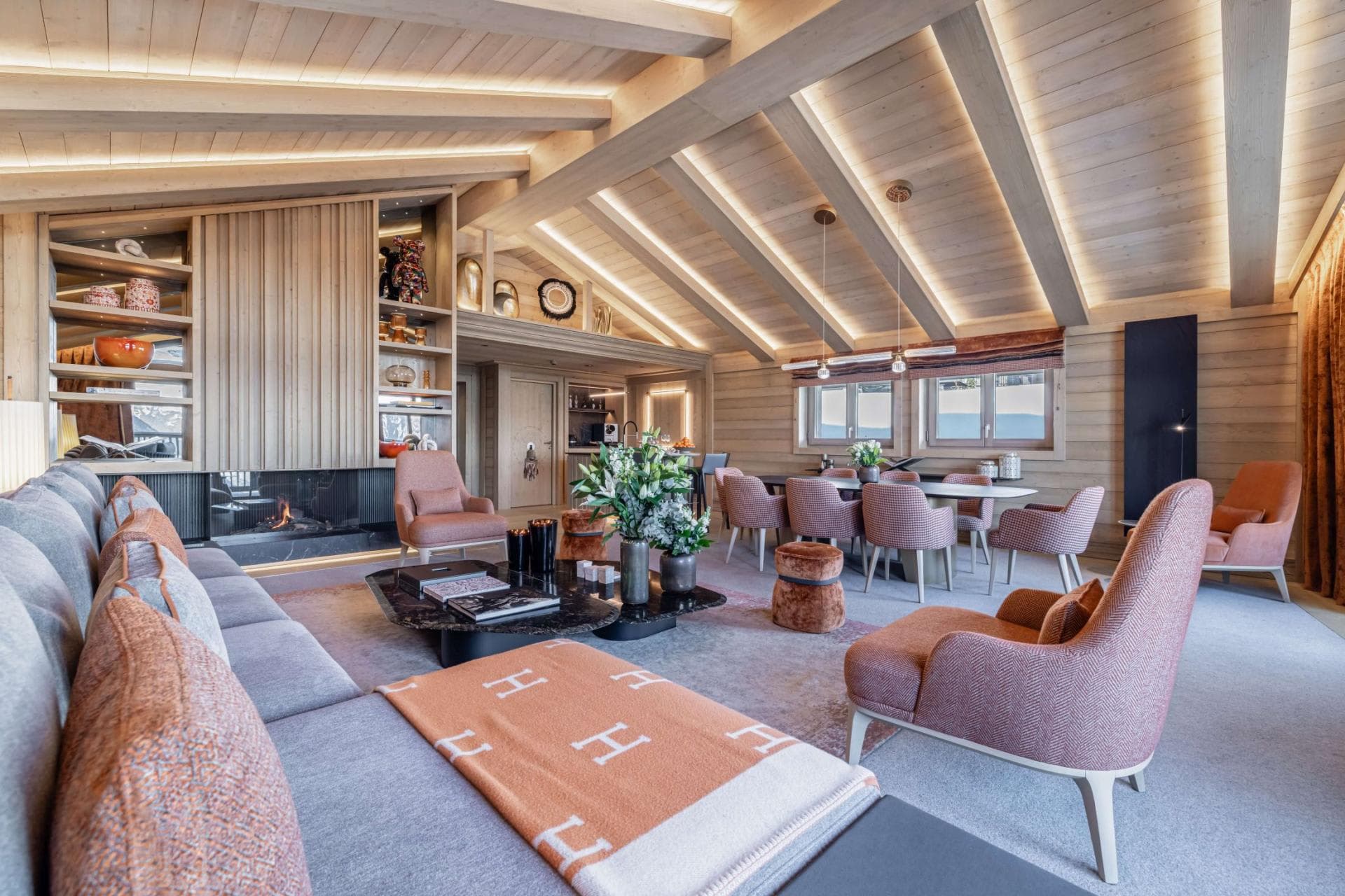 Open-plan living area with gas fireplace and dining table for 8