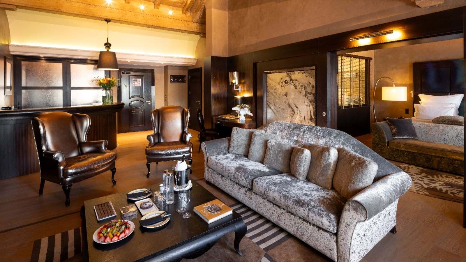 Open-plan living area and wet bar with adjacent bedroom suite