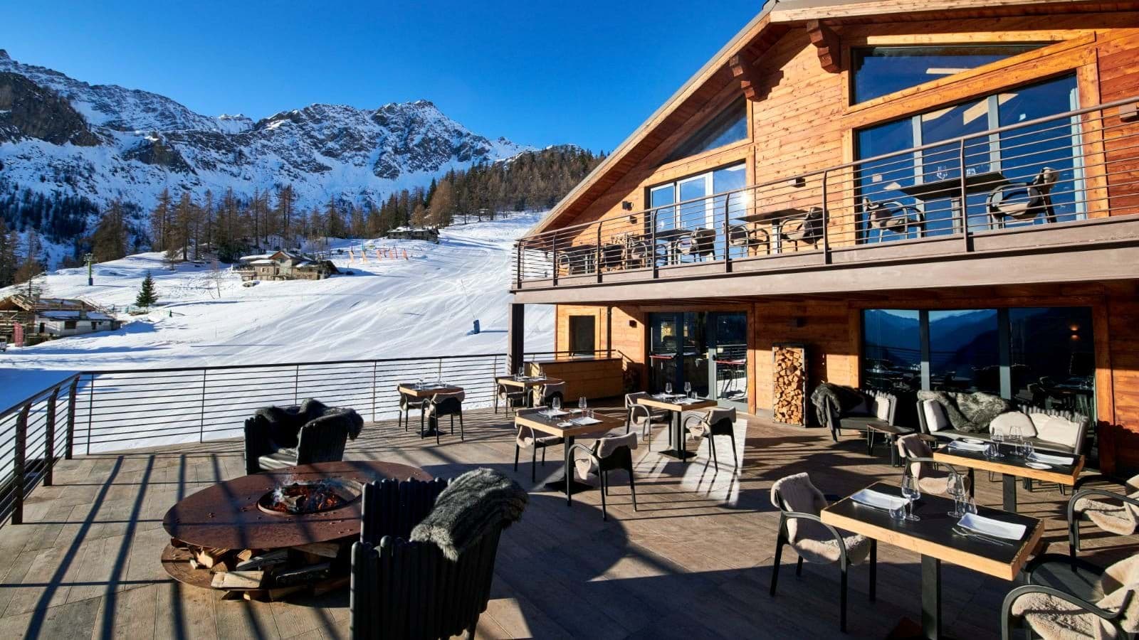 Ski-in/ski-out terrace with fire pit and mountain views