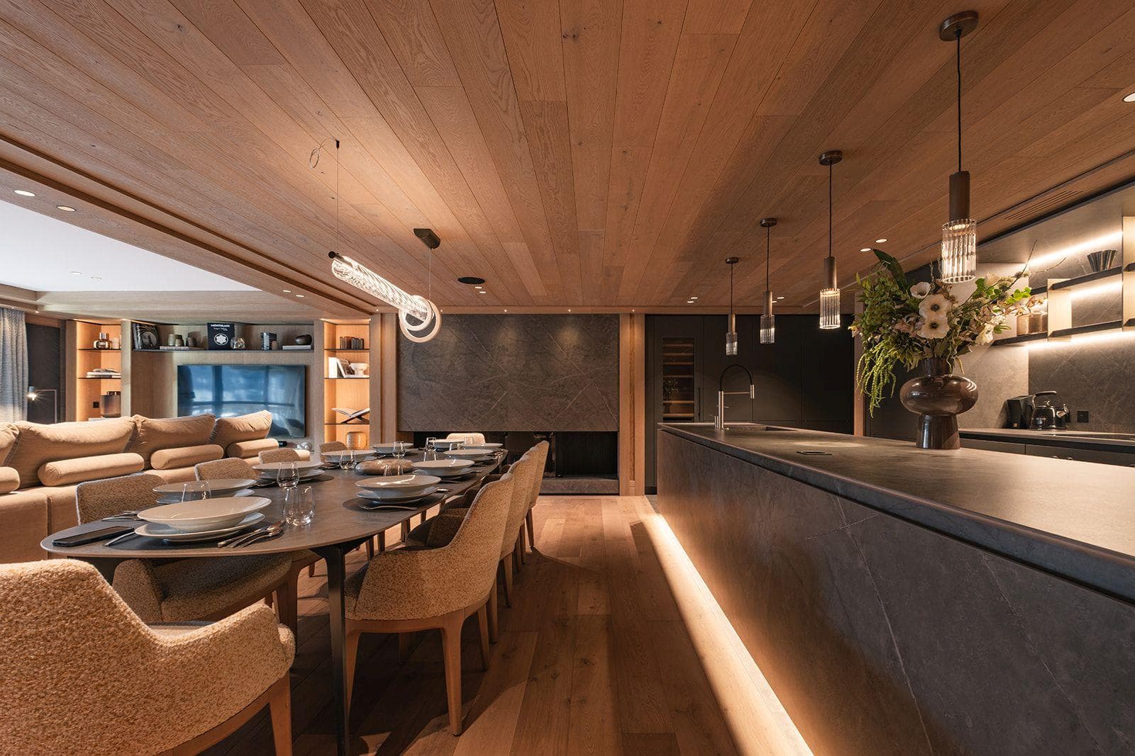 Open-plan dining area seats 10; adjacent kitchen and wine fridge