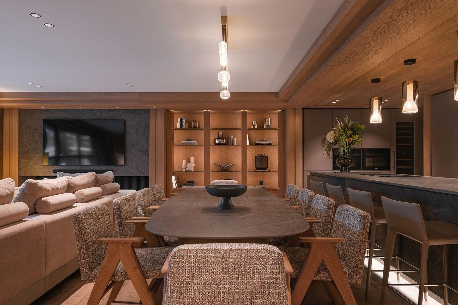 Open-plan dining area with seating for 8 and adjacent breakfast bar