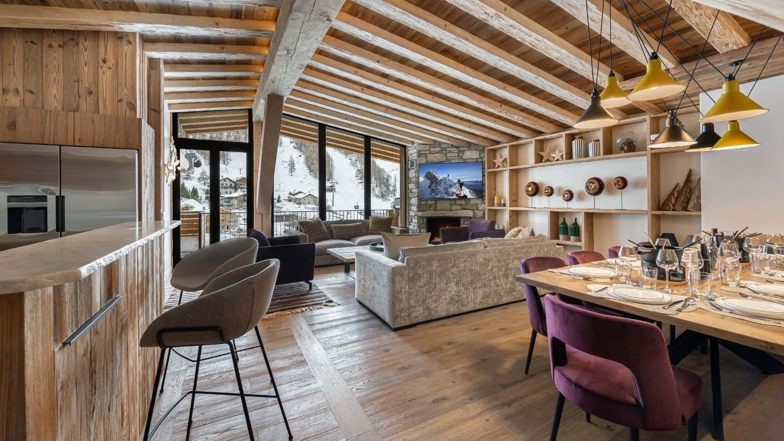 Open-plan living area with dining seating for 8 and mountain views