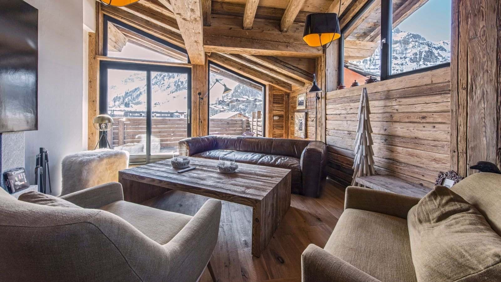 Living area with mountain views and direct balcony access