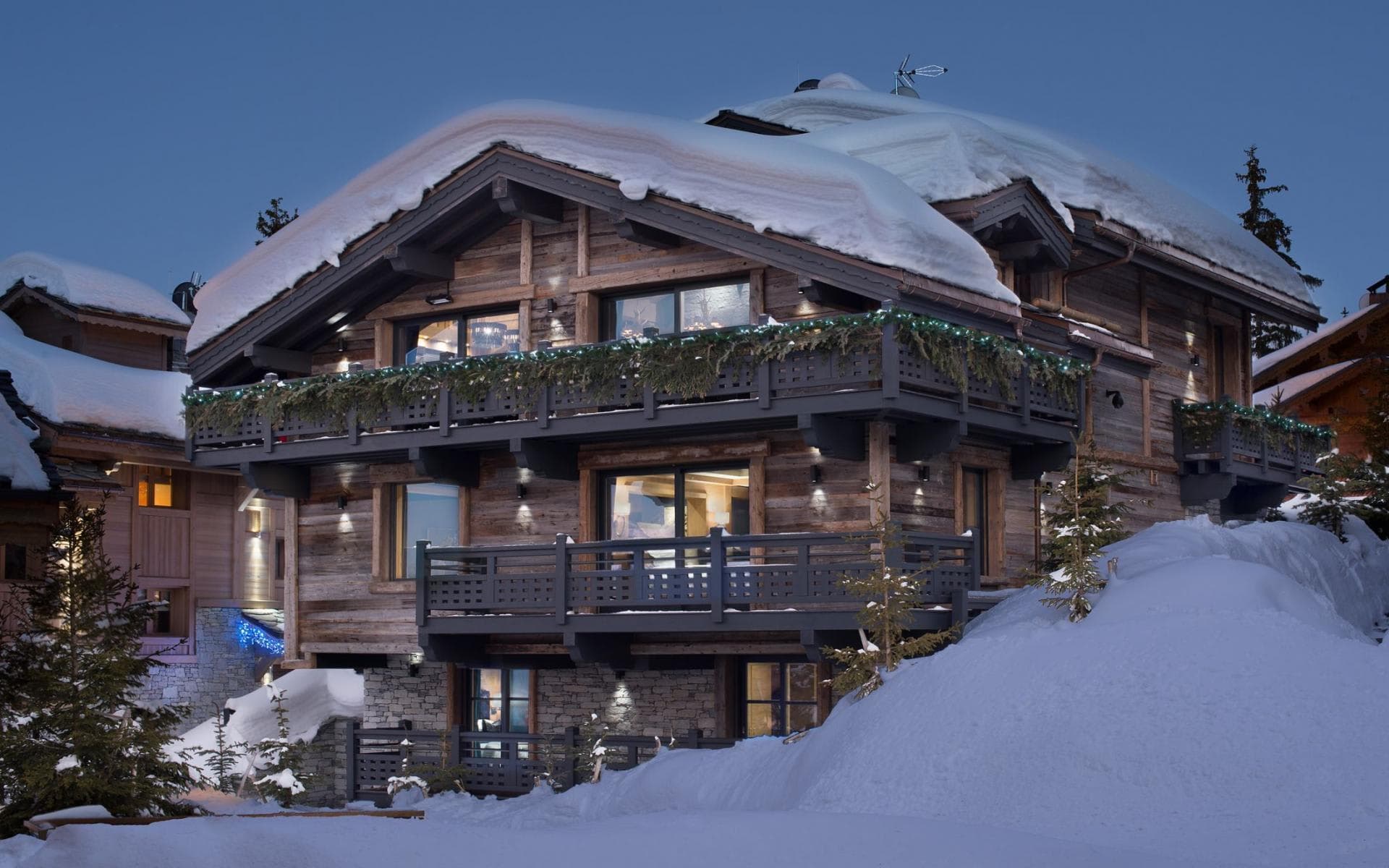Ski-in, ski-out timber chalet with wrap-around balconies