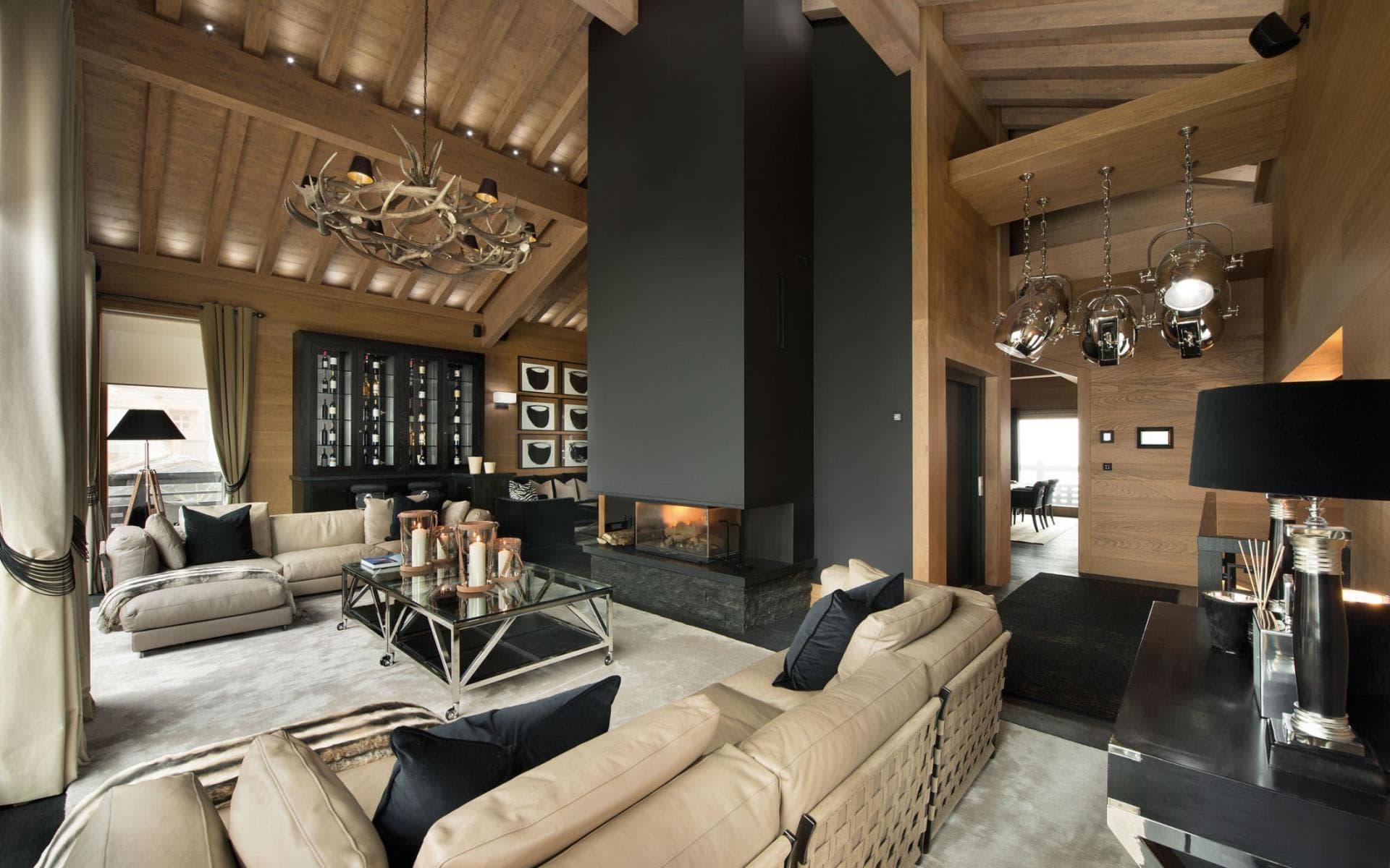 Living area with wood-burning fireplace and wine storage cabinet