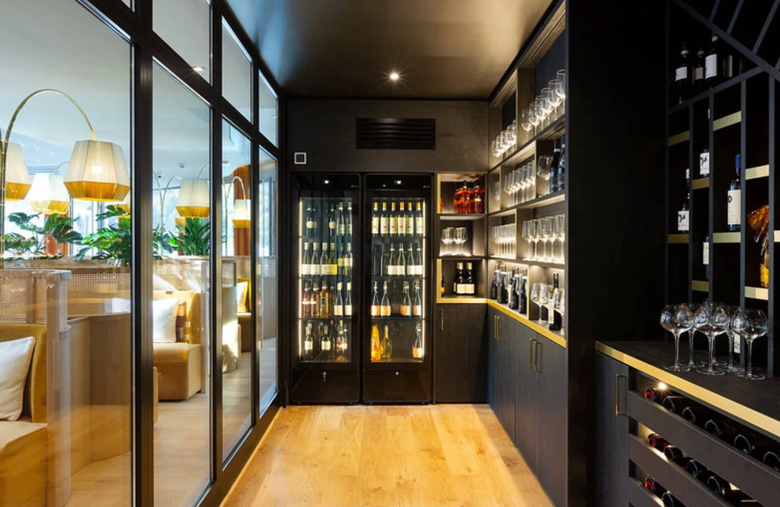Wine cellar with climate-controlled storage and glassware display