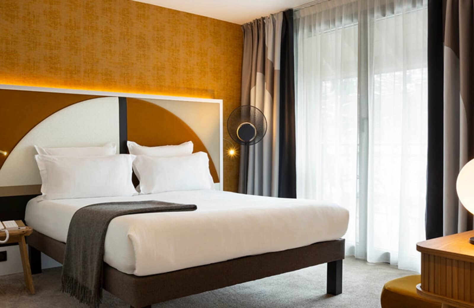 Guest bedroom with king bed and private balcony access