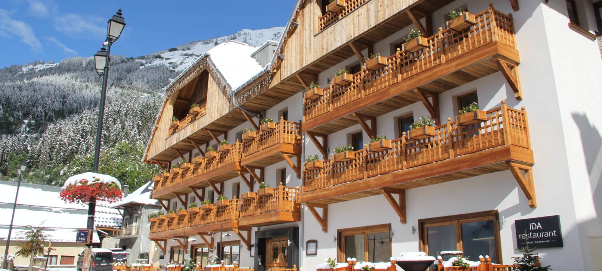 chalet exterior with private wooden balconies and on-site restaurant