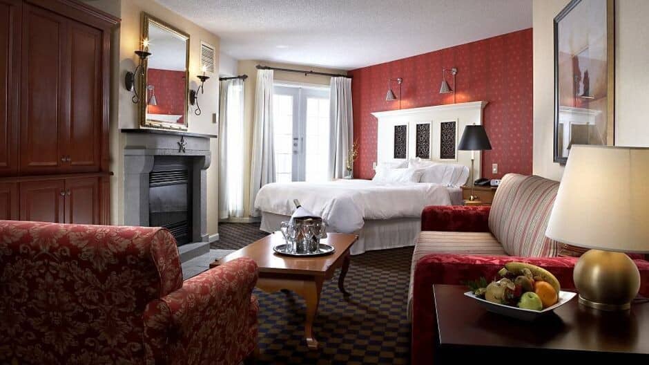 Studio suite with king bed, gas fireplace, and balcony access