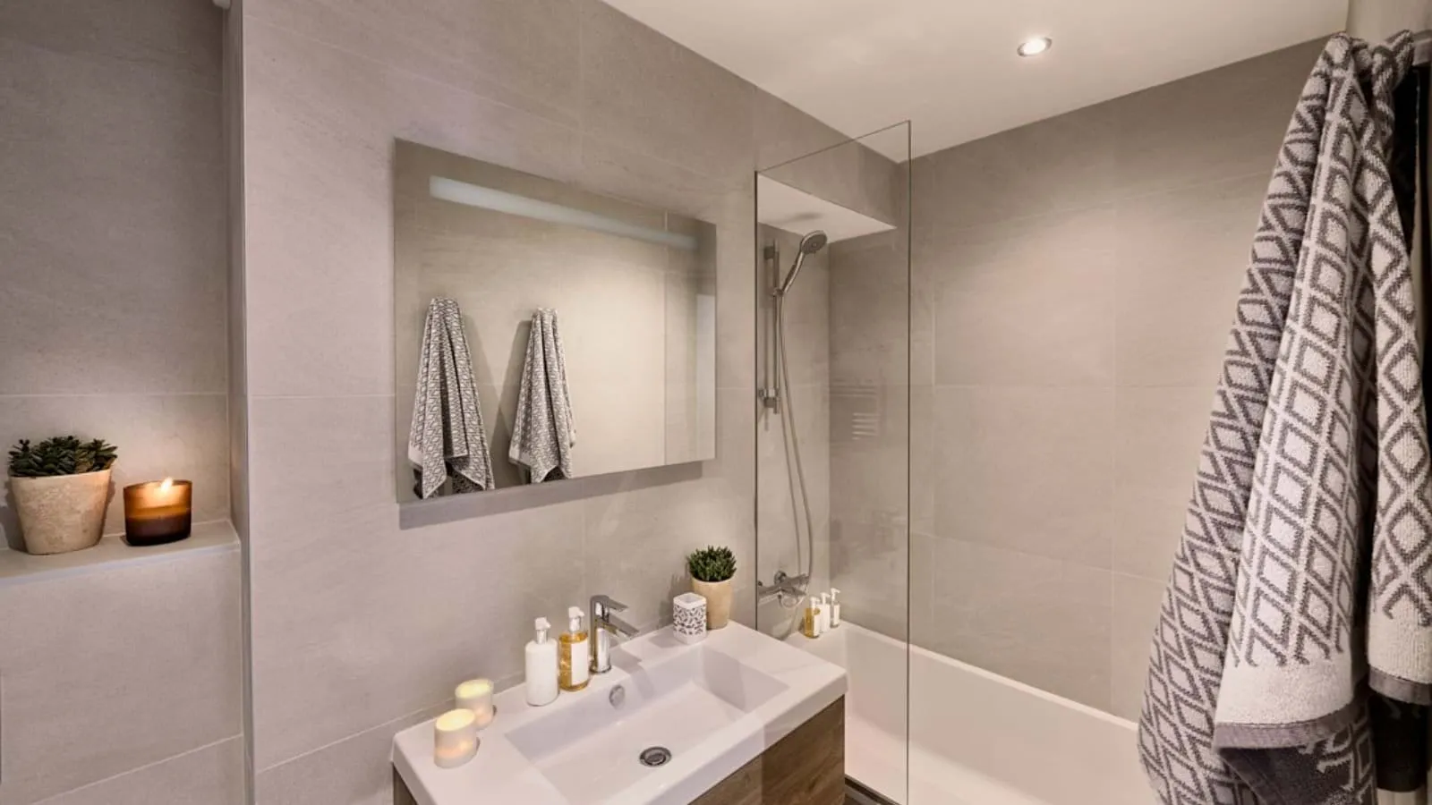 Family bathroom with bathtub, shower screen and vanity basin