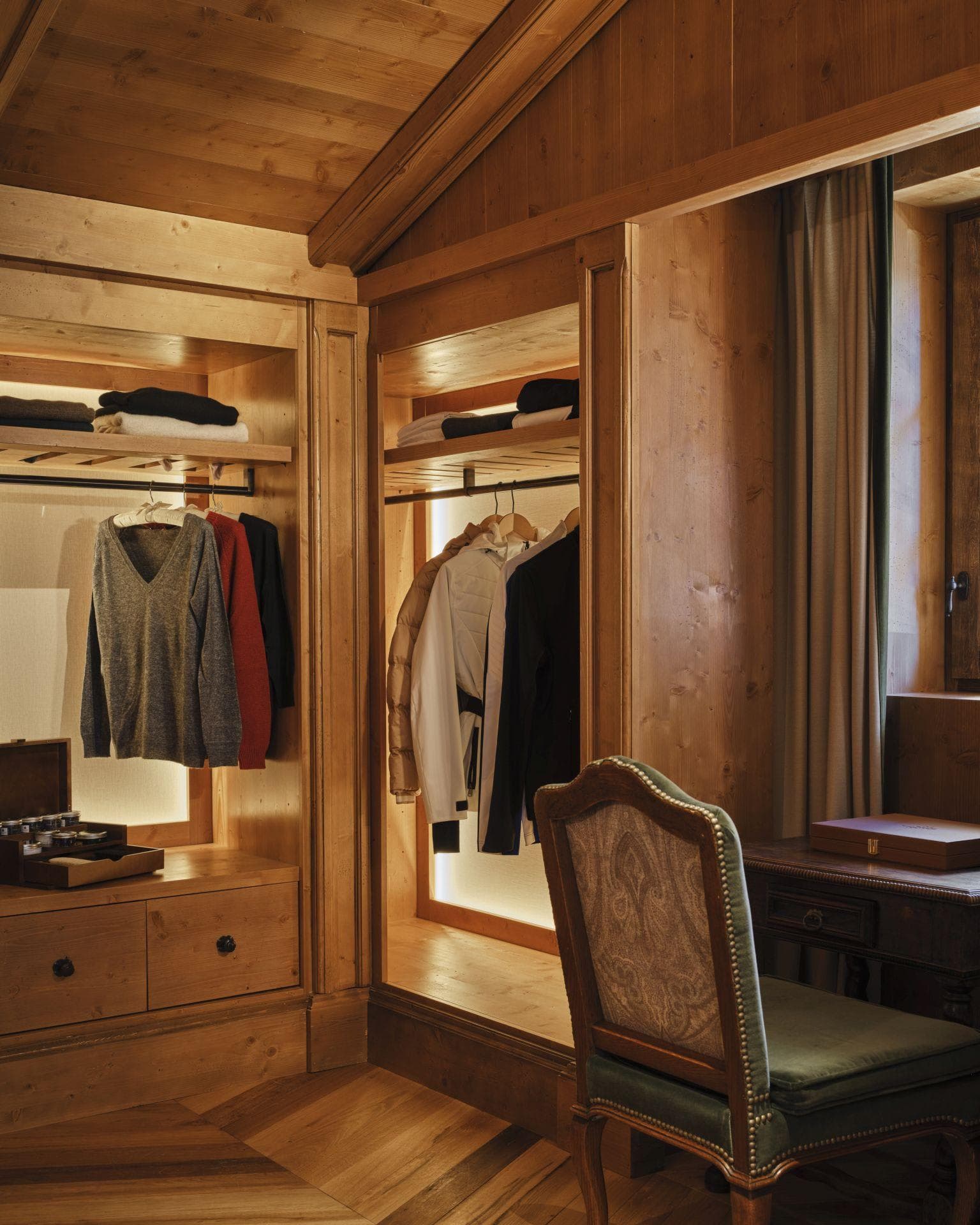 Walk-in closet with integrated LED lighting and built-in vanity desk