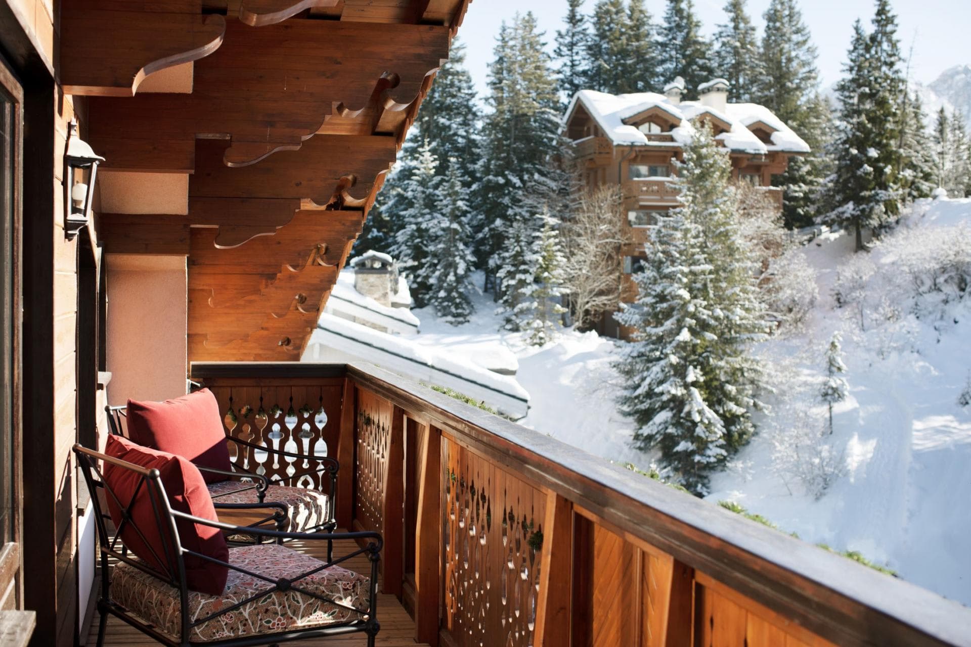 Private balcony with seating and wooded alpine views